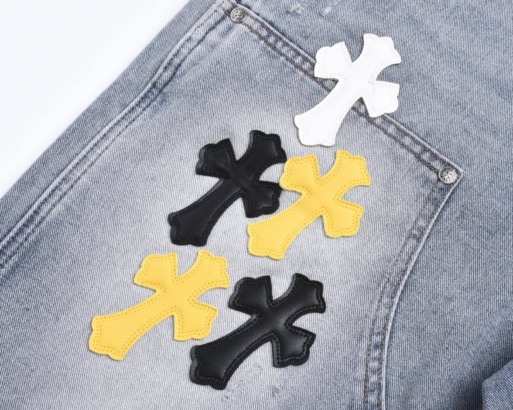 Light-Wash Denim Shorts features embroidered cross patches