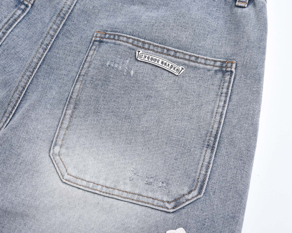 Light-Wash Denim Shorts features embroidered cross patches